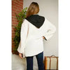 Cream Sherpa jacket with black trim and hood