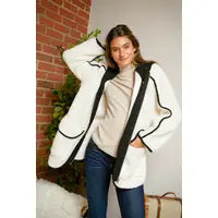 Cream Sherpa jacket with black trim and hood